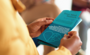 Picture of a person holding a public health brochure