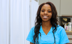 Young Black female nursing smiling