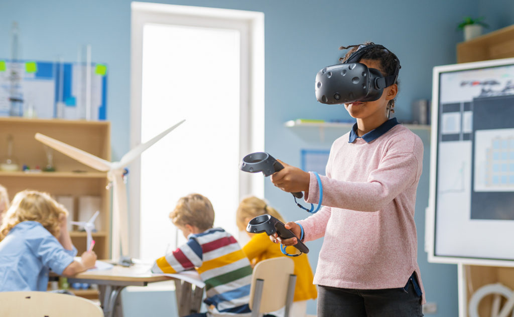 A student using a VR headset in the classroom