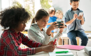 Image of students using devices at school