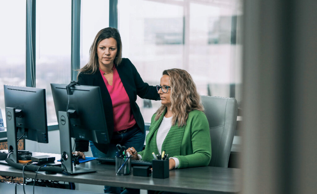 Image of ACE Chief Human Resources Officer, KK Byland, working with ACE Chief Growth Officer, Monica Carson.