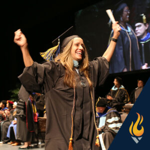 American College of Education walking across the graduation stage with their diploma