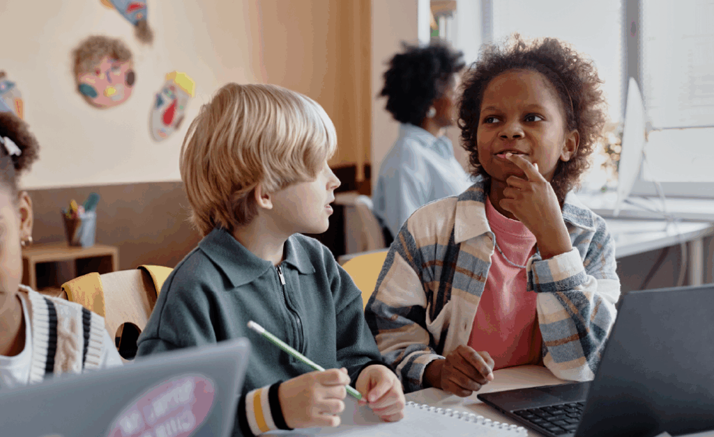 Photo of young students working on a project together