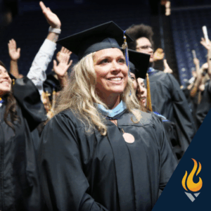 American College of Education graduate celebrating her achievement at commencement.