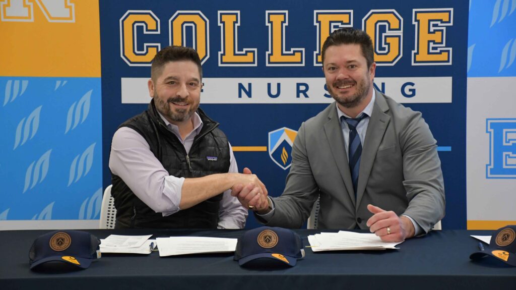 Photo of Geordie Hyland and AZCN leadership signing the agreement.