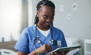 Image of nurse using a tablet