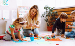 Image of special education teacher helping students