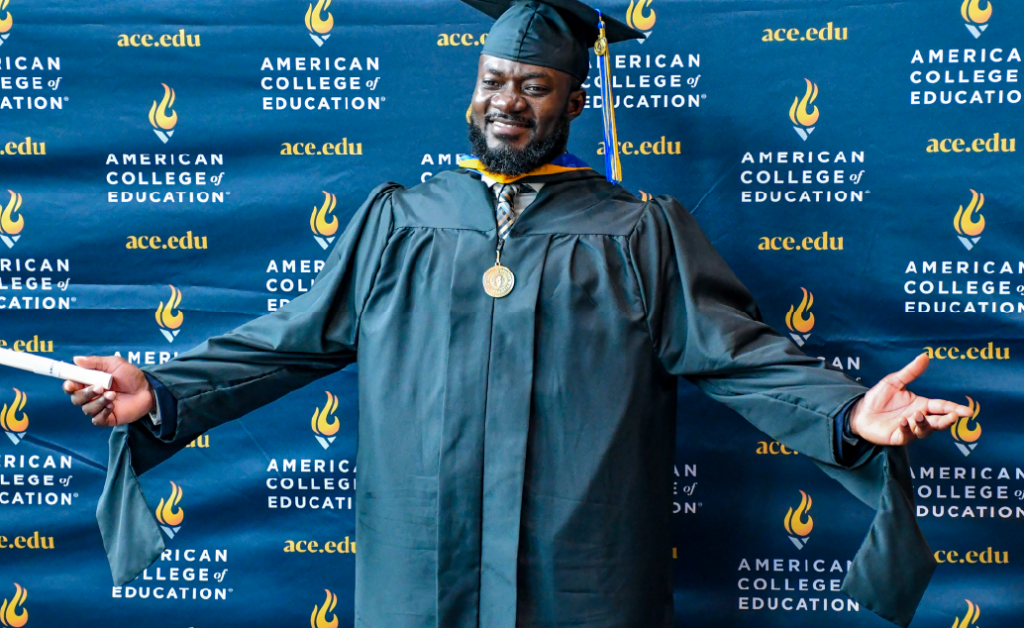An ACE graduate showcasing his regalia