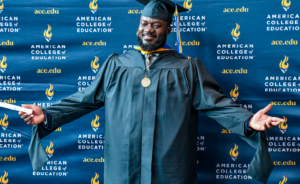 An ACE graduate showcasing his regalia