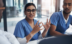 A team of nurses discussing healthcare workforce shortages